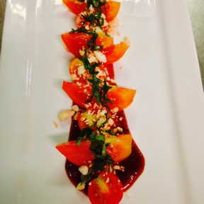 Local tomatoes Guava vinaigrette crumbled feta and fresh basil